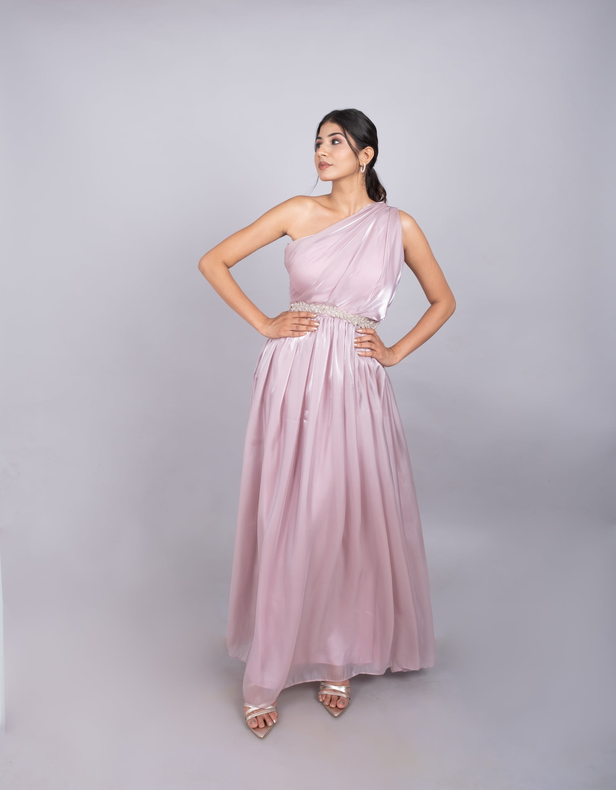 One shoulder gown in soft pink.