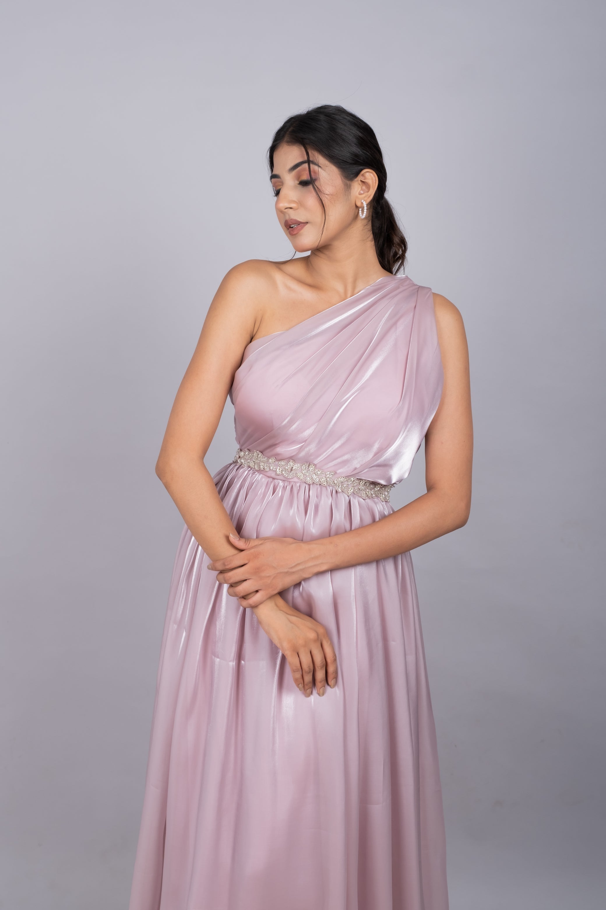 One shoulder gown in soft pink.